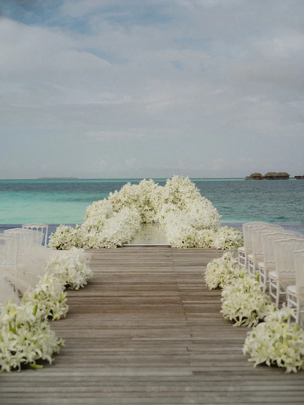 10,000 Lilies & Turquoise Waters Framed This Dreamy Beach Wedding in the Maldives