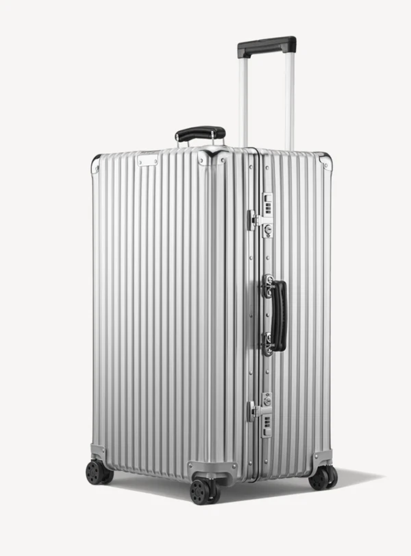 <a href="https://www.rimowa.com/us/en/luggage/colour/silver/trunk/97375004.html">RIMOWA Trunk, $2,450</a>