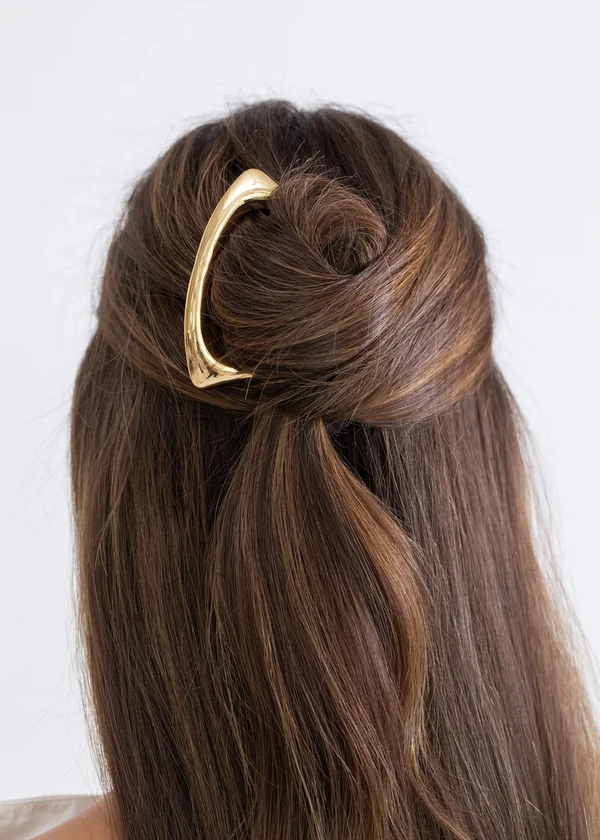 <span><a href="https://www.jenniferbehr.com/collections/hair-accessories/products/effie-hairpin-gold?variant=Gold&amp;">JENNIFER BEHR Effie Hairpin</a>, $198</span>