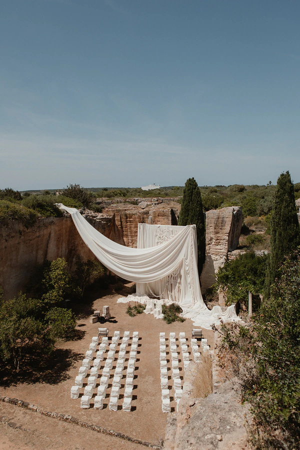 Giant Sculptural Florals & Dreamy Drapery by Mia Sylvia at This Stone Quarry Wedding in Menorca