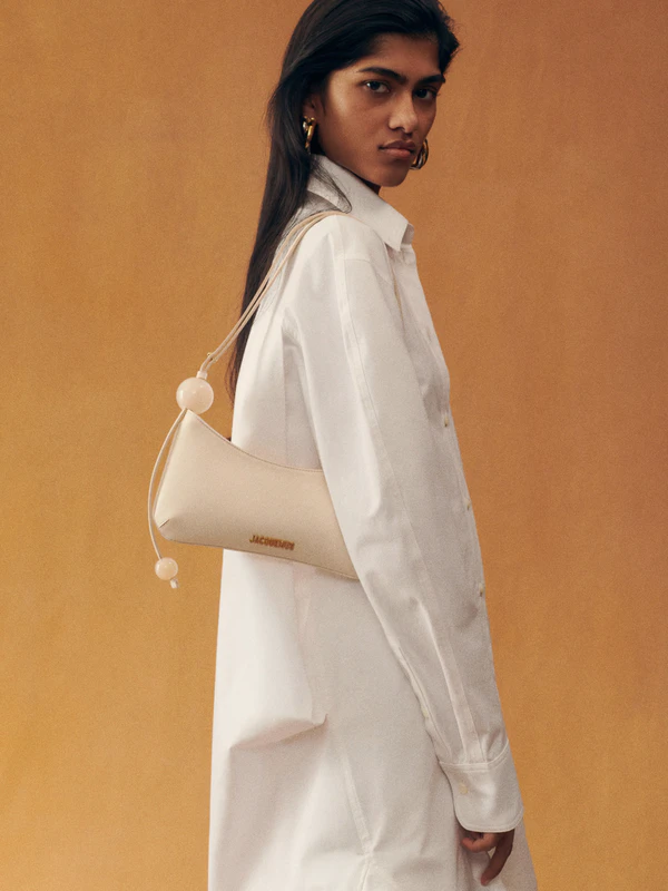 <a href="https://www.jacquemus.com/en_us/the-bisou-perle/231BA057-3108-120.html">JACQUEMUS Bag</a>, $920