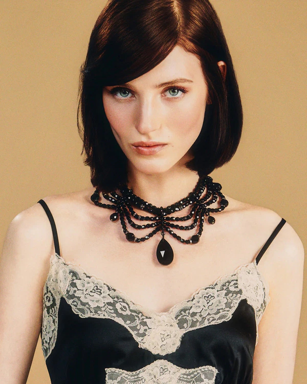 <a href="https://annasui.com/products/anna-sui-x-erickson-beamon-black-teardrop-necklace">ANNA SUI x ERICKSON BEAMON Necklace</a>, $355