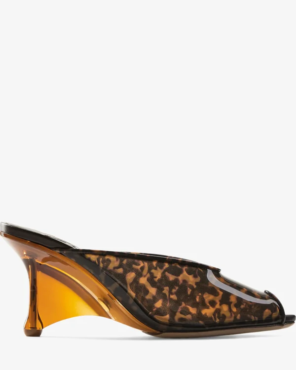 <a href="https://us.jimmychoo.com/en/women/shoes/glace-mule-80/amber-and-brown-mix-tortoiseshell-tpu-sandals-with-plexy-wedge-GLACEMULE80EVQ028043.html#page=2&start=1">JIMMY CHOO Glace Mule 80</a>, $1,750