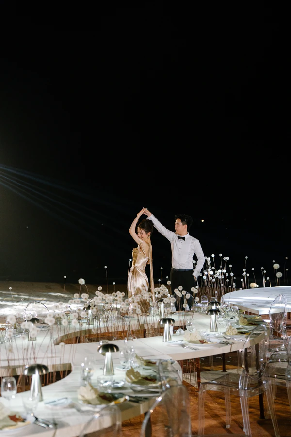 A Cinematic Beach Wedding in Vietnam with a Sunset Ceremony Framed by Dandelions