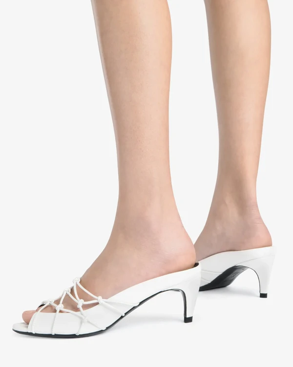 <a href="https://thejude.com/products/knotty-sandal-in-white-leather">JUDE Knotty Sandal</a>, $570