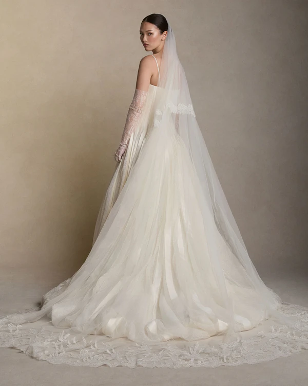 <a href="https://www.daniellefrankelstudio.com/products/chantilly-lace-degrade-border-drop-veil-cathedral">Danielle Frankel</a>