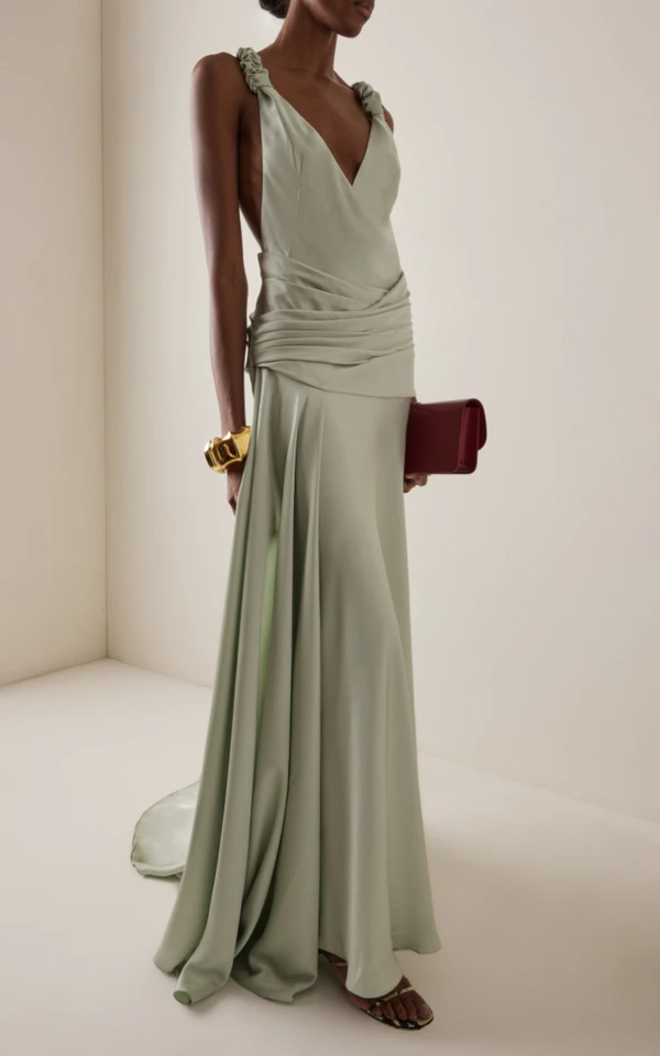 <a href="https://www.modaoperandi.com/women/p/arcina-ori/madalena-dress-mint-sta/731339?country=US&currency=USD&gad_source=1&gad_campaignid=19688803571&gbraid=0AAAAADrkIierraP8nPo4oQvX20fG4U2br&gclid=CjwKCAjwzNTUBhAjEiwA7zcvWpVCpFr_33_fVI15eYl_rmx1TC9eCeV8naBdRqIL1rmTY2oBH2VSIhoCbLUQAvD_BwE">ARCINA ORI Madalena Ruffled Satin Maxi Dress from Moda Operandi, $560</a>