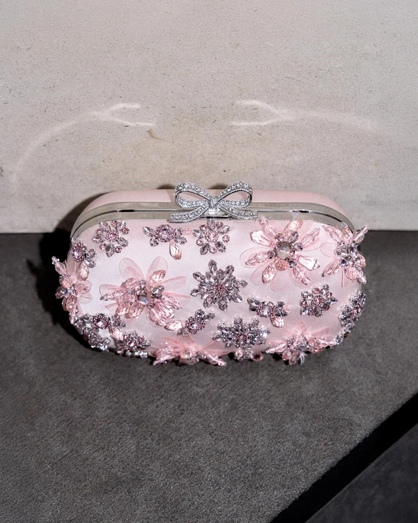 <a href="https://eu.self-portrait.com/products/rs26-pink-satin-floral-crystal-clutch">Self-Portrait</a>