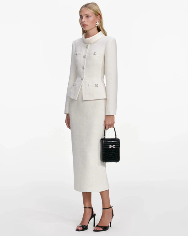 <a href="https://us.self-portrait.com/products/rs26-cream-boucle-tailored-midi-dress?country=us">SELF-PORTRAIT Dress</a>, $780