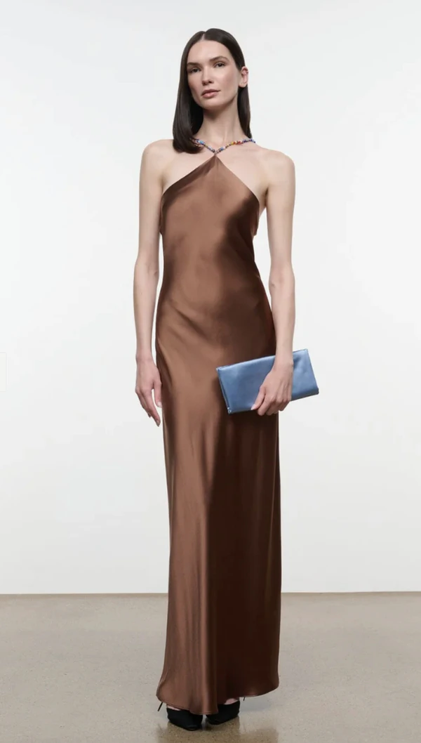 <a href="https://www.bloomingdales.com/shop/product/staud-cadence-satin-halter-dress?ID=6227681">STAUD Cadence Satin Halter Dress from Bloomingdale’s, $595</a>