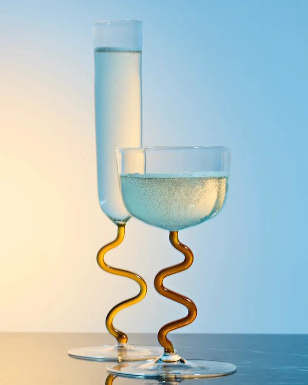 <a href="https://River Valadez Hand-Blown Glass Champagne Coupes">RIVER VALADEZ Hand-Blown Glass Champagne Coupes from Abask</a>, $365 