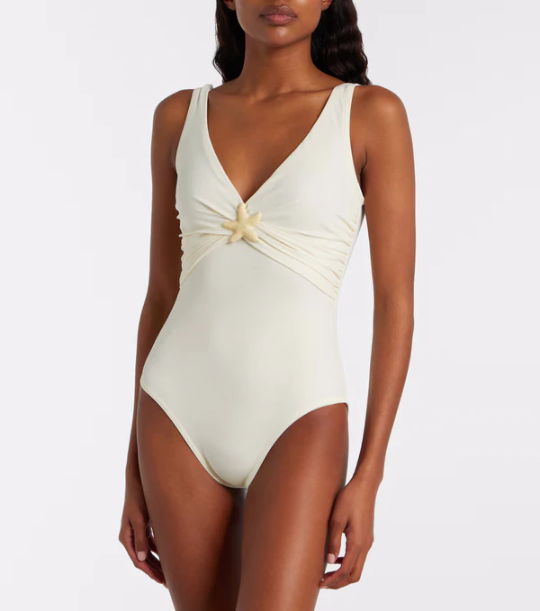 <a href="https://www.mytheresa.com/us/en/women/karla-colletto-starfish-embellished-swimsuit-white-p01170482">KARLA COLLETTO Starfish Embellished Swimsuit</a> from Mytheresa, $435