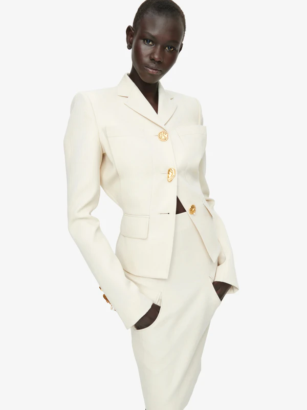 <a href="https://schiaparelli.com/en/collections/vestes-et-manteaux/products/s1wgw2s6ja0019ri0503107">SCHIAPARELLI Jacket</a>, $7200; <a href="https://schiaparelli.com/en/collections/robes-et-jupes/products/s1wgw2s6sk0022ri0503107">SCHIAPARELLI Skirt</a>, $3700