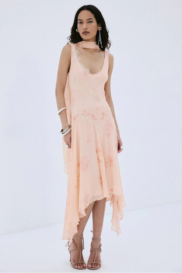 <a href="https://www.delavali.com/products/aurora-midi-dress-in-rosa-palo-pink-viscose-georgette">DE LA VALI Aurora Midi Dress</a>, $1,000