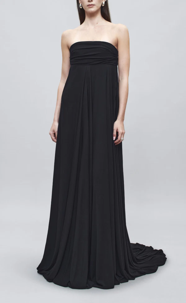 <a href="https://kallmeyer.nyc/products/dkss262017-naomi-gown-matte-jersey-black?variant=51560541618488&country=US&currency=USD&utm_medium=product_sync&utm_source=google&utm_content=sag_organic&utm_campaign=sag_organic&gad_source=1&gad_campaignid=22288440399&gbraid=0AAAAApElfdgB6b3z5FV_66br6yA5sa45h&gclid=CjwKCAjwlY3WBhANEiwApsNrLRcID8veq2xc_PEQd5_PFptxVkTh0KWPSKlkMxm0dS76kNDDjAj2khoC9j8QAvD_BwE">KALLMEYER Jersey Gown, $854</a>