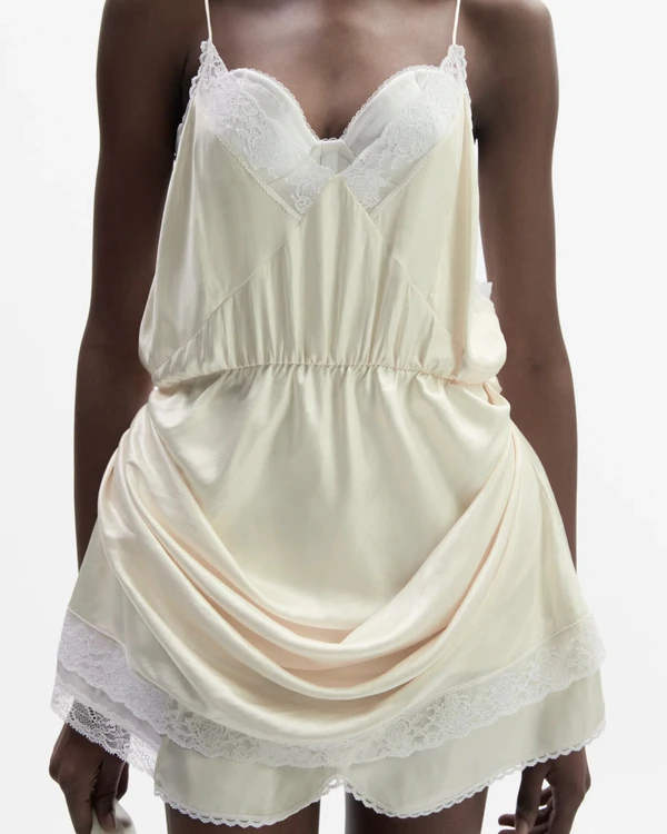 <a href="https://www.magdabutrym.com/us-en/product/ss26-dress-21-cream">MAGDA BUTRYM Slip Dress</a>, $1300