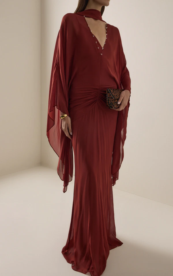<a href="https://www.modaoperandi.com/women/p/de-la-vali/florencia-maxi-dress/742291?country=US&currency=USD&gad_source=1&gad_campaignid=19688803571&gbraid=0AAAAADrkIicalznGc4lZZKhvjxHhAyPrW&gclid=CjwKCAjwlY3WBhANEiwApsNrLZmNPXupb-YSkrh_-ecrA1f7hpKOjBBZ1MBOTC7Xoc0tz9RPCAk-dxoCoNgQAvD_BwE">DE LA VALI Chiffon Maxi Dress from Moda Operandi, $985</a>