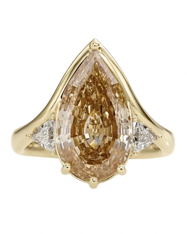 <span><a href="https://www.artemerstudio.com/collections/engagement/products/interstellar-fancy-color-pear-diamond-engagement-ring">ARTEMER Ring</a>, $45,000</span>