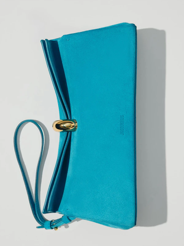 <a href="https://www.jacquemus.com/en_us/the-valerie-clutch/BAW00478AC09A04342.html">JACQUEMUS Clutch</a>, $1,550