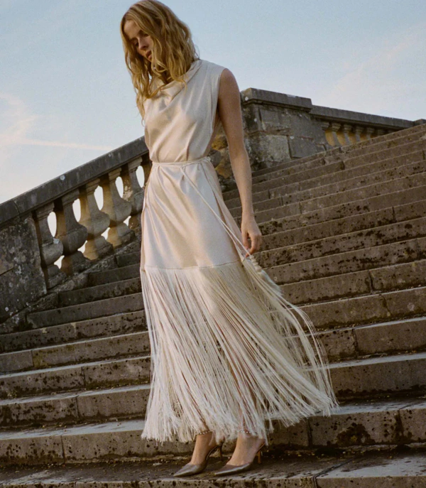 <a href="https://www.shopdoen.com/products/nellcote-anniversary-dress-candlelight?_pos=44&amp;amp;_fid=8da9bf5f2&amp;amp;_ss=c">DOEN Dress</a>, $698