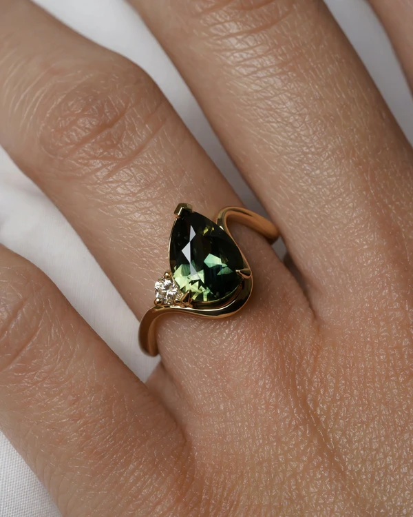 <a href="https://grewandco.com.au/products/maeva-pear-sapphire-2-47">GREW &amp; CO Ring</a>, $8,045