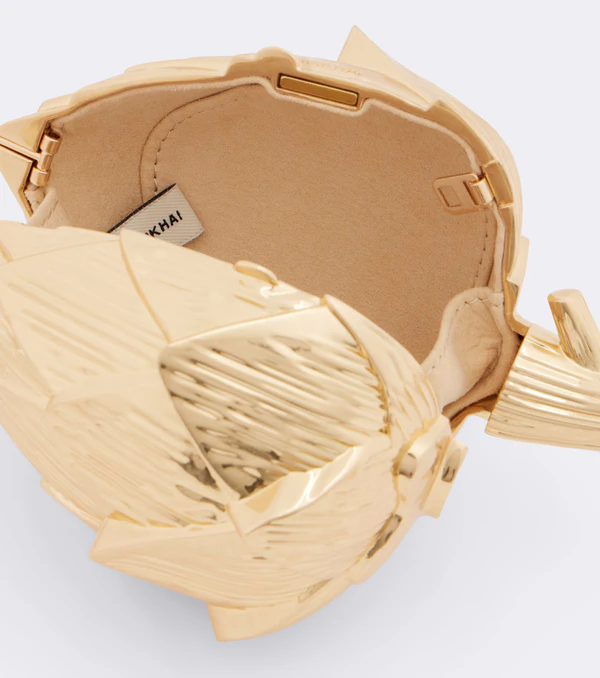 <a href="https://simkhai.com/collections/clutches-handbags/products/isabella-artichoke-clutch">SIMKHAI Bag</a>, $595