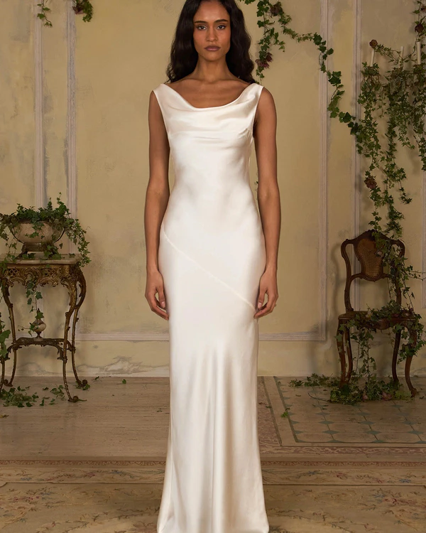 <a href="https://www.mirrorpalais.com/products/high-back-cowl-dress-in-pearl?variant=53399553867989">MIRROR PALAIS Dress</a>, $1,695