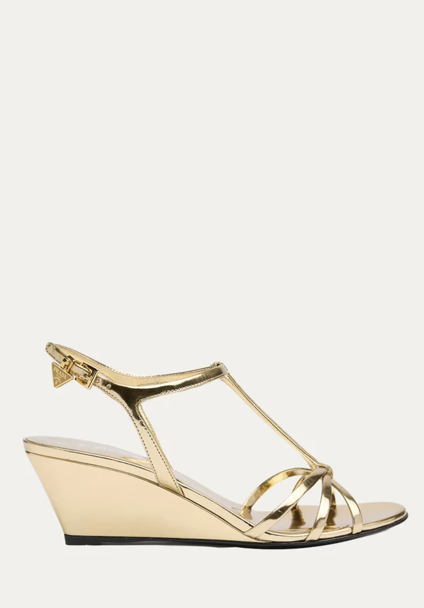 <a href="https://www.bergdorfgoodman.com/p/prada-55mm-metallic-leather-wedge-sandals-prod197470859">PRADA Wedge Sandals from Bergdorf Goodman, $1,250</a>