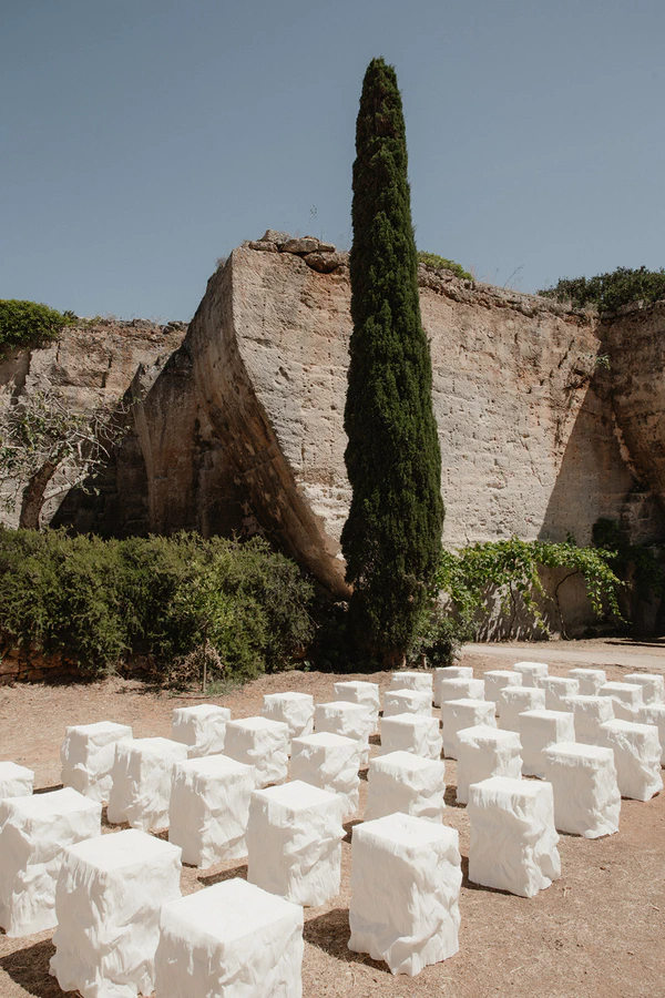 Giant Sculptural Florals & Dreamy Drapery by Mia Sylvia at This Stone Quarry Wedding in Menorca