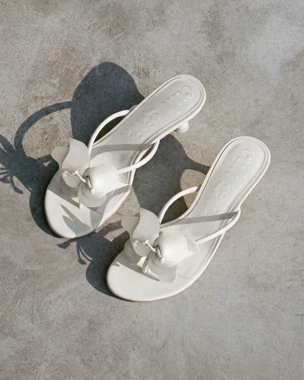 <a href="https://cultgaia.com/products/addison-sandal-antique-white?variant=43342983135306">CULT GAIA Addison Sandal</a>, $498