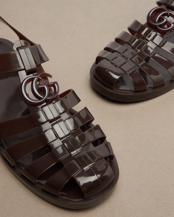 <a href="https://www.mytheresa.com/us/en/women/gucci-glossy-double-g-fisherman-sandals-brown-p01131160">GUCCI Glossy Double G Fisherman Sandals</a> from Mytheresa, $710