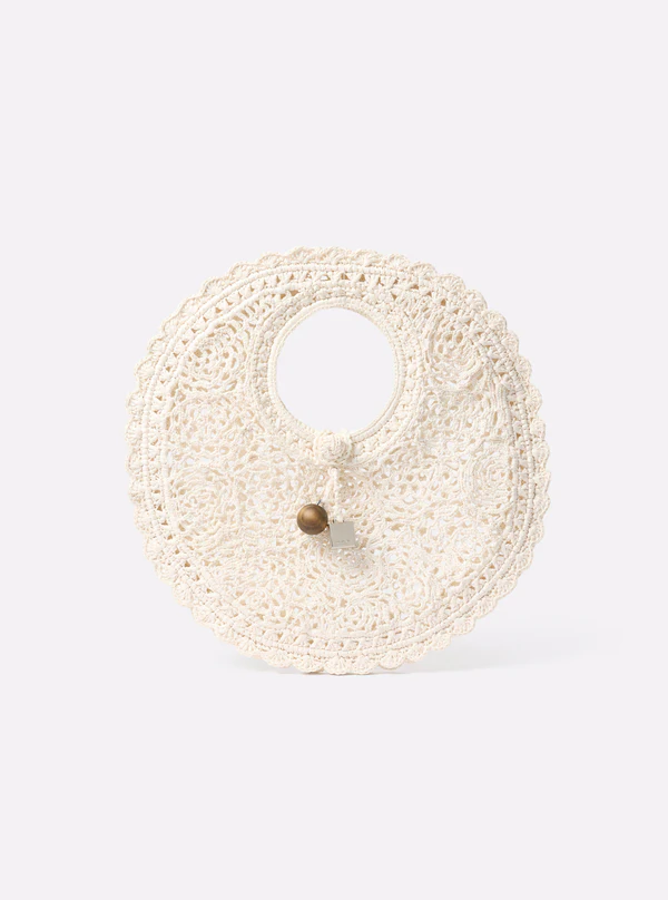 <a href="https://www.jacquemus.com/en_us/the-spiaggia-small-round-bag/BAW00445AW00623100.html">JACQUEMUS Bag</a>, $1,250