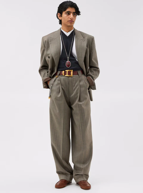 <a href="https://www.versace.com/us/en/men/clothing/blazers-suits/pinstripe-wool-boxy-blazer-gray/1023620-1A17854_2KX00.html">VERSACE Blazer</a>, $3790