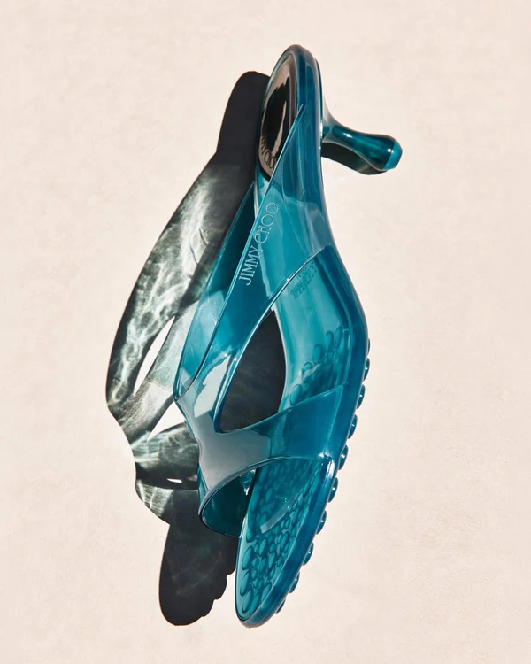 <a href="https://us.jimmychoo.com/en/women/shoes/jelly-drop-50/amber-jelly-sandals-JELLYDROP50TPZ070004.html?_gl=1*1y2p4dq*_gcl_aw*R0NMLjE3ODM5NTk2MjkuQ2p3S0NBandtZExTQmhBTkVpd0FrUkVNTjM1LW1WQjhReklaQkp3RUhRYkFzNlNGX2w1SlhuSnc2elVtajVQSXhyX0ZZU2U2NlpaMTlSb0NTMndRQXZEX0J3RQ..*_gcl_dc*R0NMLjE3ODM5NTk2MjkuQ2p3S0NBandtZExTQmhBTkVpd0FrUkVNTjM1LW1WQjhReklaQkp3RUhRYkFzNlNGX2w1SlhuSnc2elVtajVQSXhyX0ZZU2U2NlpaMTlSb0NTMndRQXZEX0J3RQ..*_gcl_au*NzQ5MzE1NDU2LjE3ODM5MzMxNDk.*_ga*MTQ3NjYyNjUyNS4xNzgzOTMzMTQ4*_ga_MRK1BFNGCQ*czE3ODM5NjQ5NzMkbzMkZzEkdDE3ODM5NjQ5ODUkajQ4JGwwJGgxOTg2MzU3Mjk0">JIMMY CHOO Jelly Drop 50</a>, $595