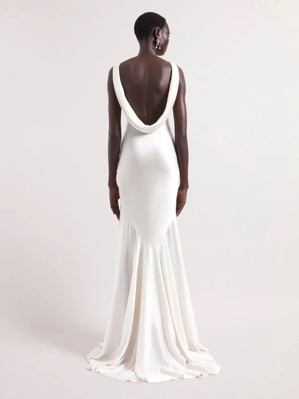 <a href="https://www.ninaricci.com/en-us/fashion/product/mermaid-dress-with-open-back-26acro060se1415u1230">NINA RICCI Dress</a>, $1,695