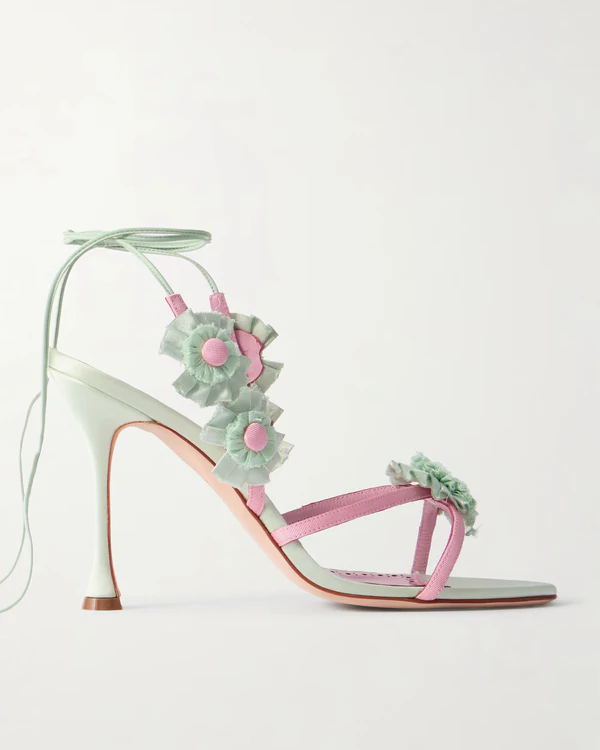 <a href="https://www.net-a-porter.com/en-us/shop/product/manolo-blahnik/shoes/high-heel/palissot-105-leather-trimmed-appliqued-grosgrain-and-satin-sandals/46376663162925898">MANOLO BLAHNIK Palissot 105 Appliquéd Grosgrain and Satin Sandals</a> from Net-a-Porter, $1,895
