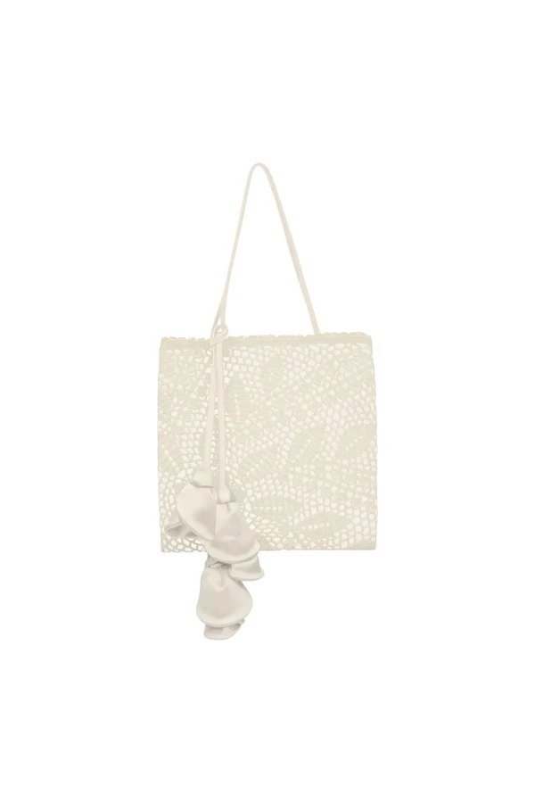 <a href="https://www.magdabutrym.com/us-en/product/aw26-julia-bag-cream-satin-with-cream-crochet">MAGDA BUTRYM Bag</a>, $1,350