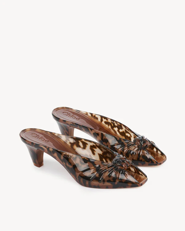 <a href="https://www.chloe.com/en-us/p/shoes/sandals/CH26A17OYF296.html">CHLOÉ Jelly Mule</a>, $745