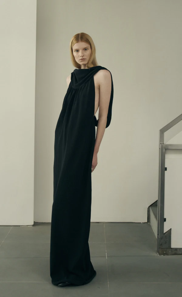 <a href="https://kallmeyer.nyc/collections/evening/products/dkpf26kn2030-priya-cowl-neck-gown-cotton-nylon-black">KALLMEYER Cowl Neck Gown, $1,056</a>