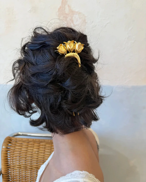 <a href="https://www.eponavalley.com/collections/hair-pins/products/rose-vine-hair-pin">EPONA VALLEY Rose &amp; Vine Hair Pin</a>, $158