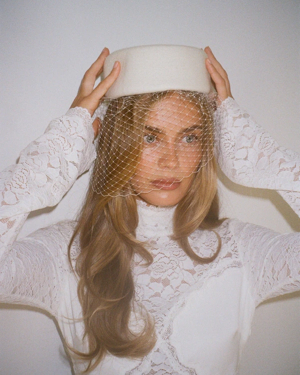 <a href="https://magnoliaave.com.au/products/esther-netted-pillbox-hat">Magnolia Ave.</a>