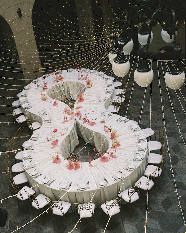 A Whimsical Wedding with a Giant Bow & Curved Tablescape