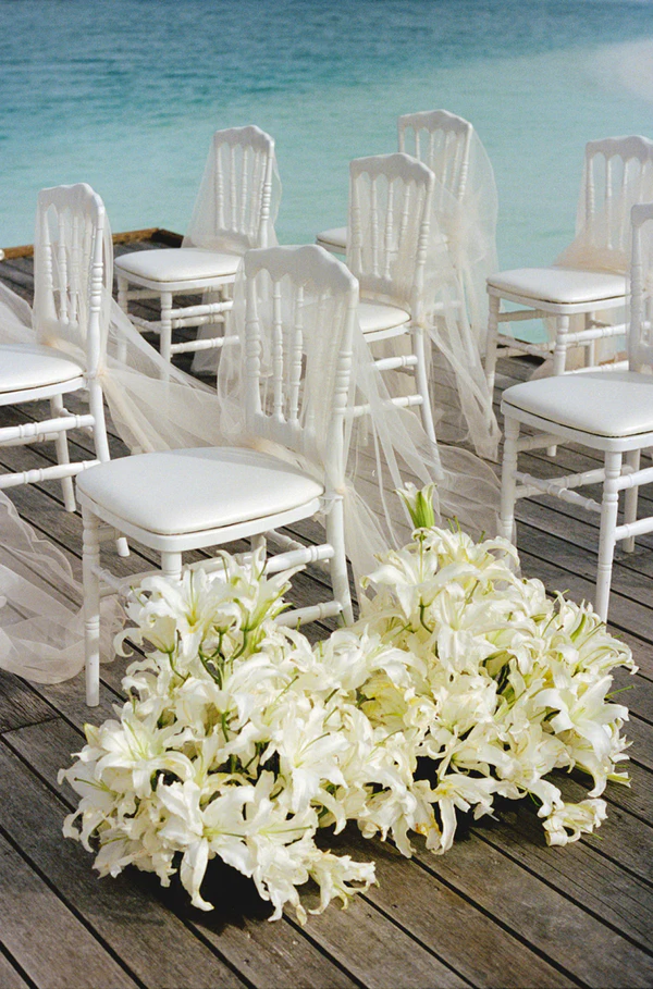 10,000 Lilies & Turquoise Waters Framed This Dreamy Beach Wedding in the Maldives