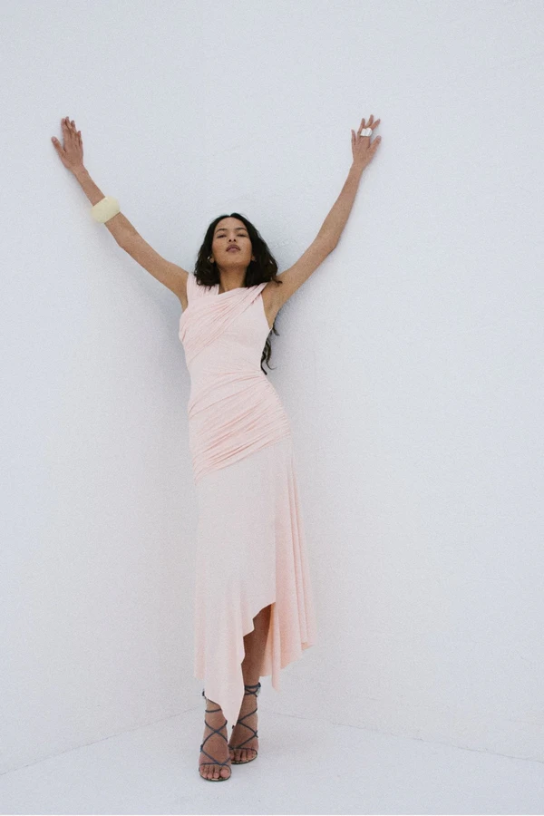 <a href="https://www.delavali.com/products/hela-midi-dress-in-baby-pink-spandex-jersey">DE LA VALI Hela Midi Dress</a>, $820