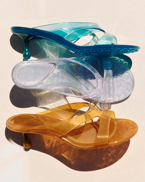 <a href="https://us.jimmychoo.com/en/women/shoes/jelly-drop-50/silver-glitter-jelly-sandals-JELLYDROP50NMJAA0009.html#start=1">JIMMY CHOO Jelly Drop 50</a>, $595