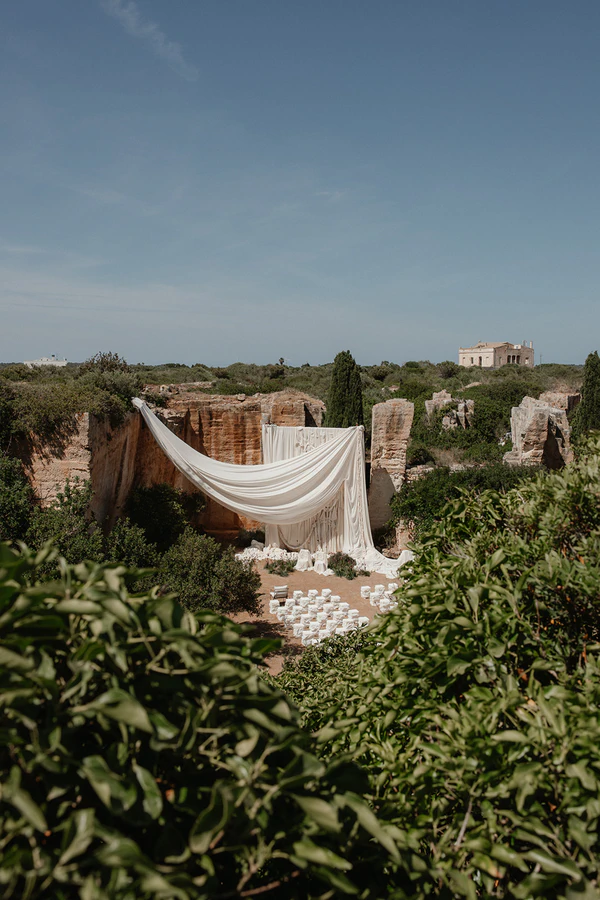 Giant Sculptural Florals & Dreamy Drapery by Mia Sylvia at This Stone Quarry Wedding in Menorca