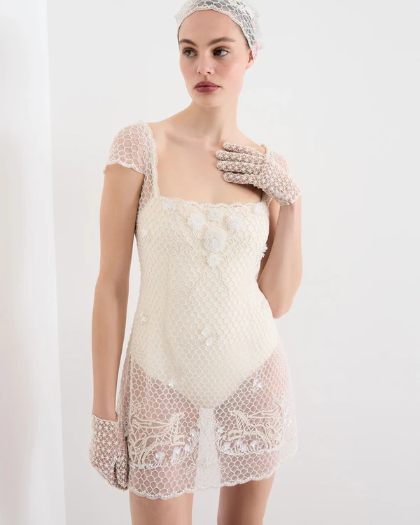 <a href="https://cliopeppiatt.co.uk/products/cora-crochet-mini-dress" target="_blank">CLIO PEPPIATT Cora Crochet Mini Dress, $2,220</a>
