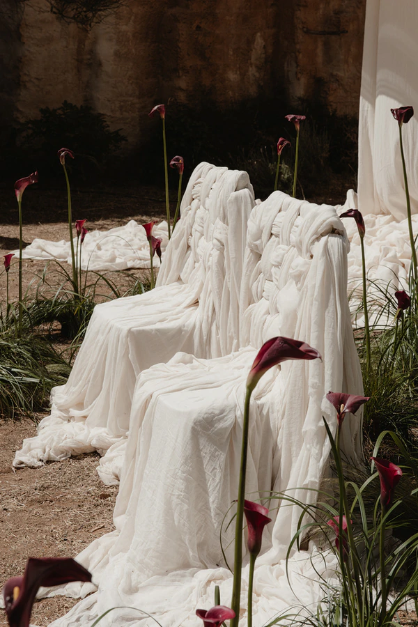 Giant Sculptural Florals & Dreamy Drapery by Mia Sylvia at This Stone Quarry Wedding in Menorca