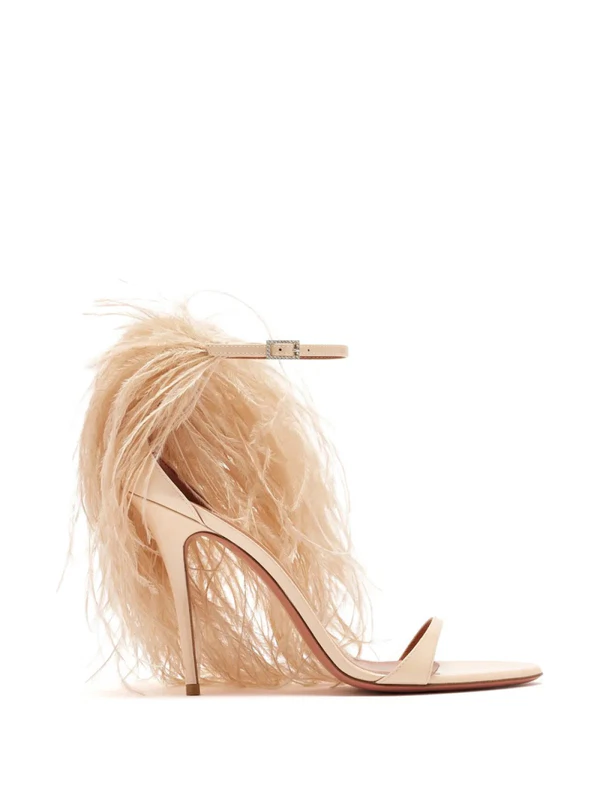 <a href="https://www.farfetch.com/shopping/women/amina-muaddi-jerry-feather-trim-sandals-item-38751390.aspx">AMINA MUADDI Jerry Sandals from Farfetch</a>, $1,730
