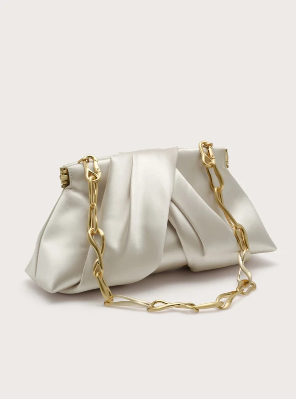 <a href="https://cultgaia.com/products/lia-mini-clutch-pearl">CULT GAIA Bag</a>, $498